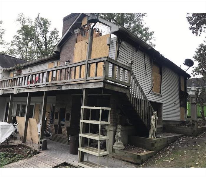 House with boarded-up windows and doors