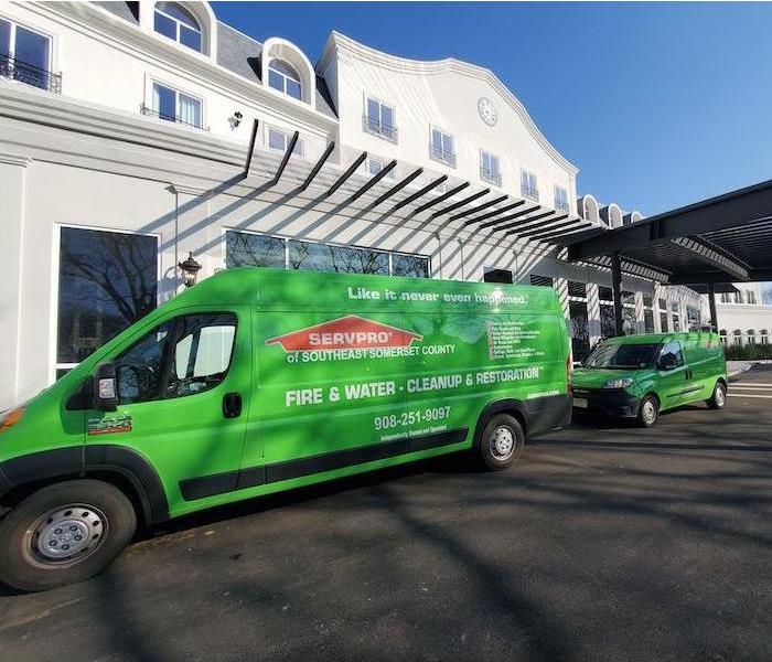 Green SERVPRO van in front of the hotel