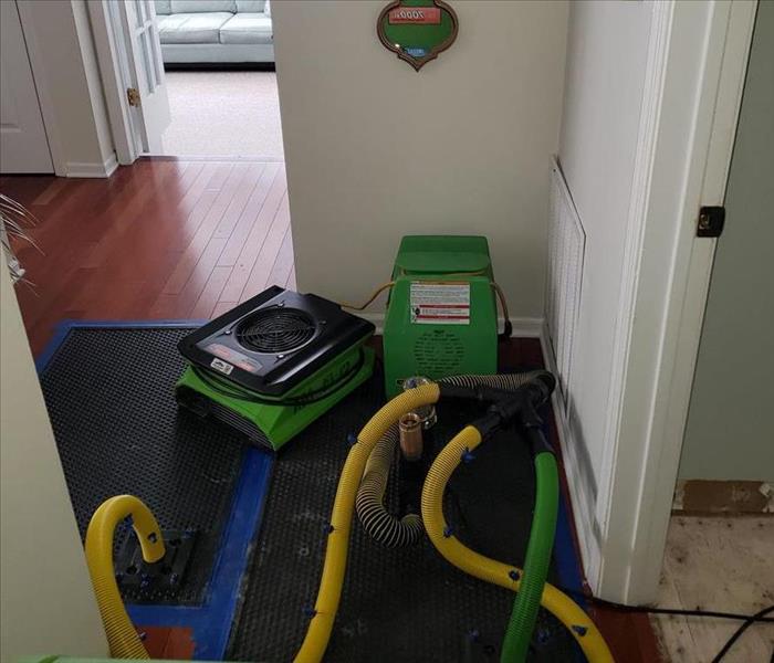 SERVPRO equipment on the kitchen floor