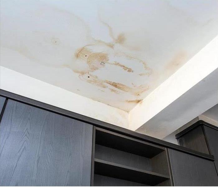 water stains on ceiling and wall cabinets