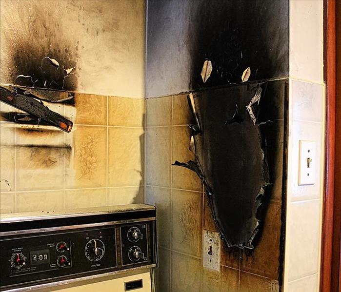 fire and soot damage in kitchen