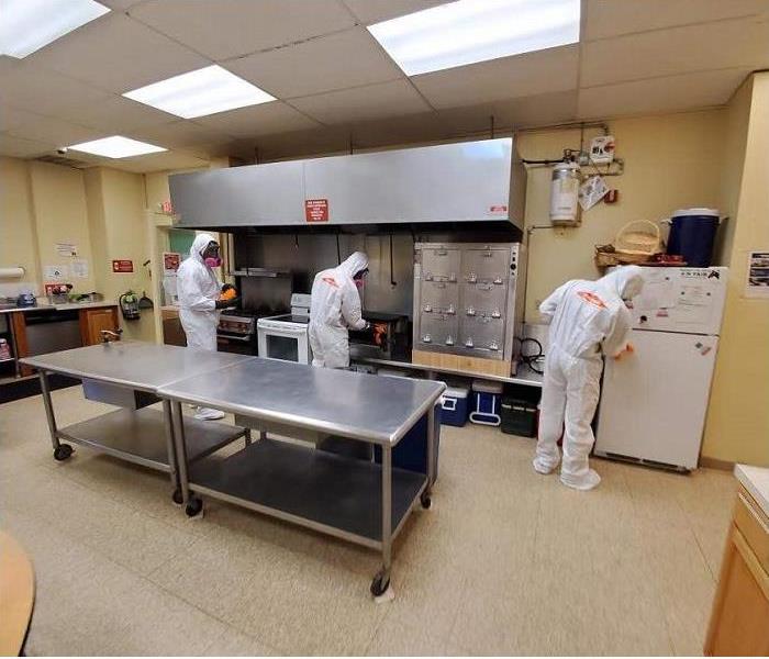 SERVPRO Technicians in PPE Equipment Cleaning a Commercial Kitchen